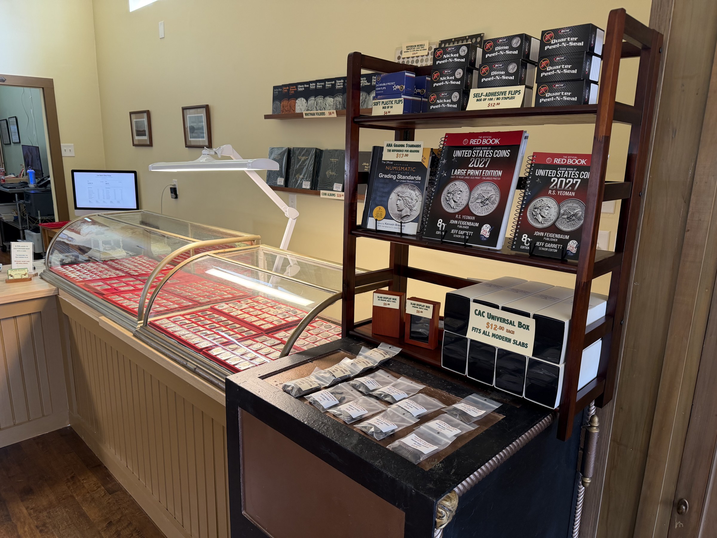 LSCEX interior with display cases, Red Book references, and supplies