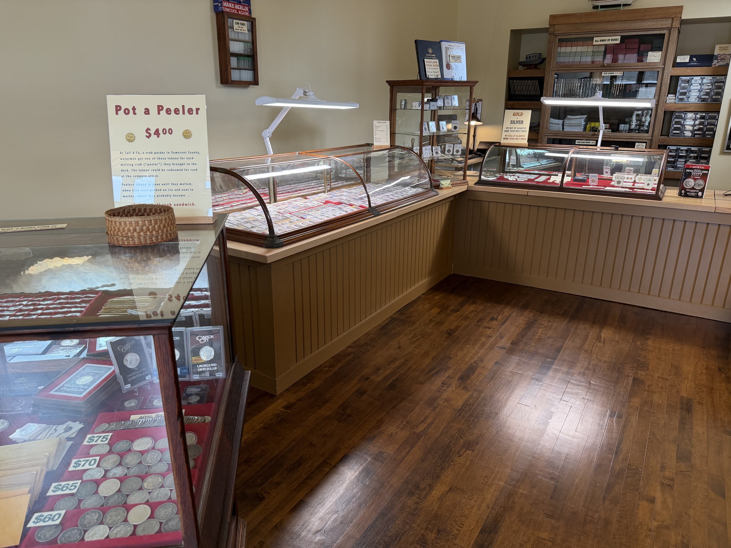 Interior of LSCEX showing coin display cases and reference books